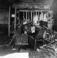 A pile of charred desks and other debris in room 210 where firemen tossed them as they searched the room for bodies. (Photo courtesy of The Catholic New World with photo research by Renee Jackson)