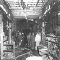 Firemen inspect the destruction after all bodies have been removed from the ravaged school. This hallway was the only interior escape route for the children and teachers in five of the six second floor classrooms in the north wing. By the time occupants of the rooms knew there was a fire, this hallway was already impassable, leaving the windows with their 25 foot drop as the only means of escape. Some children escaped through the windows but many were overcome by smoke or flames before they could get out.
