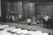 Caskets are lined up as the funeral mass gets underway at the Illinois National Guard Armory on the Friday following the fire. The grief felt by parents and parishioners was overwhelming.